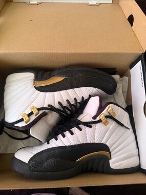 Jordan 12 Taxi Black and White sneakers
